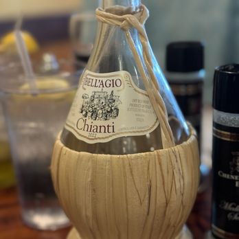 Frank's Grill - Old school straw wrapped wine. - Seafood Near Me - Marathon, Florida