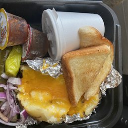 Stuff baked potato . Had put the brisket on it yet though. Stuff baked potato . Had put the brisket on it yet though.