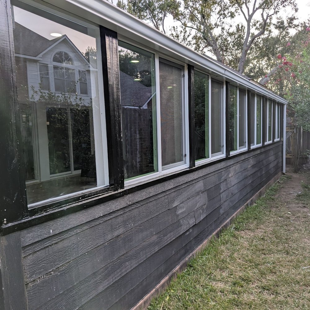 Quality Affordable Remodeling Team - Covered patio with new windows - General Contractors Near Me