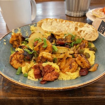 First Watch - Shrimp and Grits with roasted tomatoes and andouille sausage. - American Near Me - Concord, North Carolina