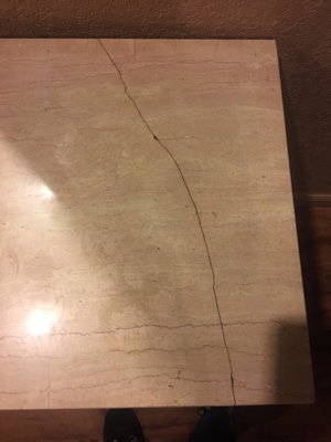 Photo of Broadway Motel - Oakland, CA, US. Cracked side table