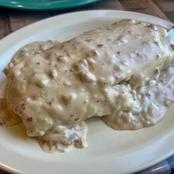 Hello Deli - Chicken Fried Steak Burrito: Scrambled eggs, chicken fried steak, hashbrowns, cheese, and diced green chile, smothered with gravy. - Delis Near Me - Albuquerque, New Mexico