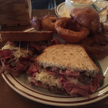 Sutter Buttes Brewing - Pastrami Reuben with onion rings - Pubs Near Me - Yuba City, California Sutter Buttes Brewing - Pastrami Reuben with onion rings - Pubs Near Me - Yuba City, California