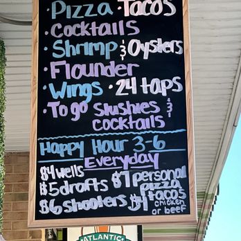 Atlantic Pints - Board outside of the restaurant that said five dollar happy hour beers, but they charge us seven dollars apiece for them - Beer Bar Near Me - Virginia Beach, Virginia
