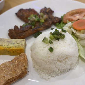 Com Tam Saigon - a plate of rice, meat, and vegetables - Vietnamese Near Me - Katy, Texas Com Tam Saigon - a plate of rice, meat, and vegetables - Vietnamese Near Me - Katy, Texas