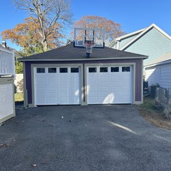 A1 Overhead garage door - 2-8x7 raised panel steel doors in Melrose Ma.