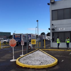 Budget Truck Rental - People standing around doing nothing.