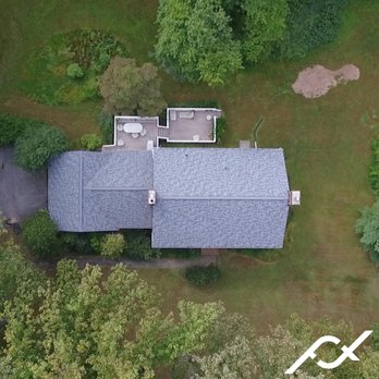 Four Twelve Roofing - an aerial view of a house - Roofing Near Me - Baltimore, Maryland