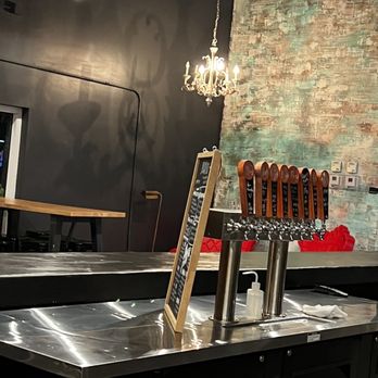 Black Flamingo - a row of beer taps on a counter - Breweries Near Me - Oakland Park, Florida Black Flamingo - a row of beer taps on a counter - Breweries Near Me - Oakland Park, Florida