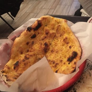 Tandoor Indian Restaurant - Garlic nan but seasoned with garlic powder instead of fresh with butter and herbs. - Indian Near Me - Arlington, Texas