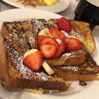 Niko's Breakfast Club - Classic French Toast with strawberries and bananas plus a side of whip cream. - Breakfast & Brunch Near Me - Romeoville, Illinois Niko's Breakfast Club - Classic French Toast with strawberries and bananas plus a side of whip cream. - Breakfast & Brunch Near Me - Romeoville, Illinois