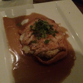 Guy Fieri's Kitchen + Bar - Hard seared salmon in a sweet sesame glaze on a bed of mushroom risotto. - Steakhouses Near Me - Council Bluffs, Iowa Guy Fieri's Kitchen + Bar - Hard seared salmon in a sweet sesame glaze on a bed of mushroom risotto. - Steakhouses Near Me - Council Bluffs, Iowa