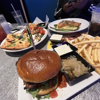 Dave & Buster's Ala Moana - NEW Crispy Cauliflower Truffle Fries Burrata Mozzarella Bruschetta Shrimp Scampi Flatbread Drunk Mushroom Burger Grilled Atlantic Salmon - Arcades Near Me - Honolulu, Hawaii
