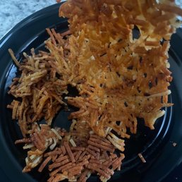 Over cooked hash browns buried under my toppings.