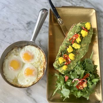 Motek - Avocado toast with sunny side up eggs. - Mediterranean Near Me - Aventura, Florida Motek - Avocado toast with sunny side up eggs. - Mediterranean Near Me - Aventura, Florida