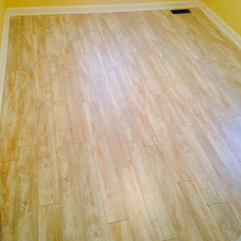 Hughes Services - a hardwood floor in a room - Flooring Near Me Hughes Services - a hardwood floor in a room - Flooring Near Me