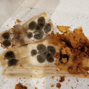 Sky Liquor - a slice of pizza with moldy topping - Beer, Wine & Spirits Near Me - San Diego, California
