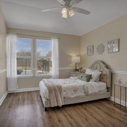 Bouquet Homes Assisted Living & Memory Care - The Primrose - Private Bedroom - Furnished by our interior decorator and painted a soothing "Almond Milk" hue.