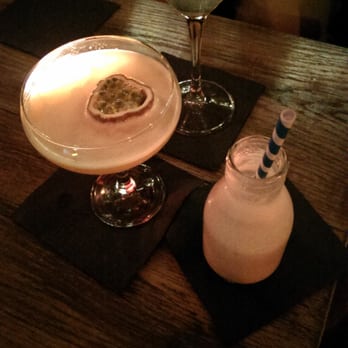 The Plotting Parlour - White Crush (in the milk bottle), Porn Star (with the passionfruit) and Gimlet (at the top) - Cocktail Bars Near Me - Brighton, ESX