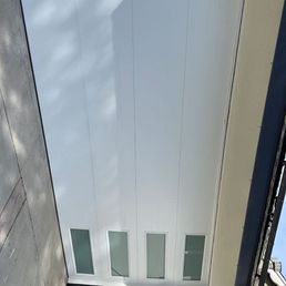 Exterior outside entrance of Noels Garage Doors - Smooth white Exterior outside entrance of Noels Garage Doors - Smooth white