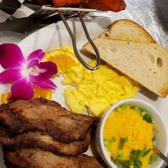 Table 57 - Tri tip and eggs with a side of sweet potato fries. The Jalapeño grits and fries were incredible!!! - Breakfast & Brunch Near Me - Visalia, California