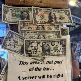 Siesta Key Oyster Bar - Inside of the restaurant is filled with dollar bills throughout the restaurant. - Seafood Near Me - Sarasota, Florida