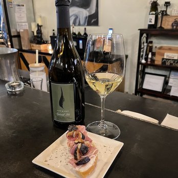 cellar twenty four - a glass of wine and a plate of food - Wine Bars Near Me - The Woodlands, Texas