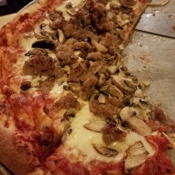 Pizzamania - The leftovers of a medium pizza after 2 big eaters tried to take ot down! - Pizza Near Me - Long Beach, California Pizzamania - The leftovers of a medium pizza after 2 big eaters tried to take ot down! - Pizza Near Me - Long Beach, California