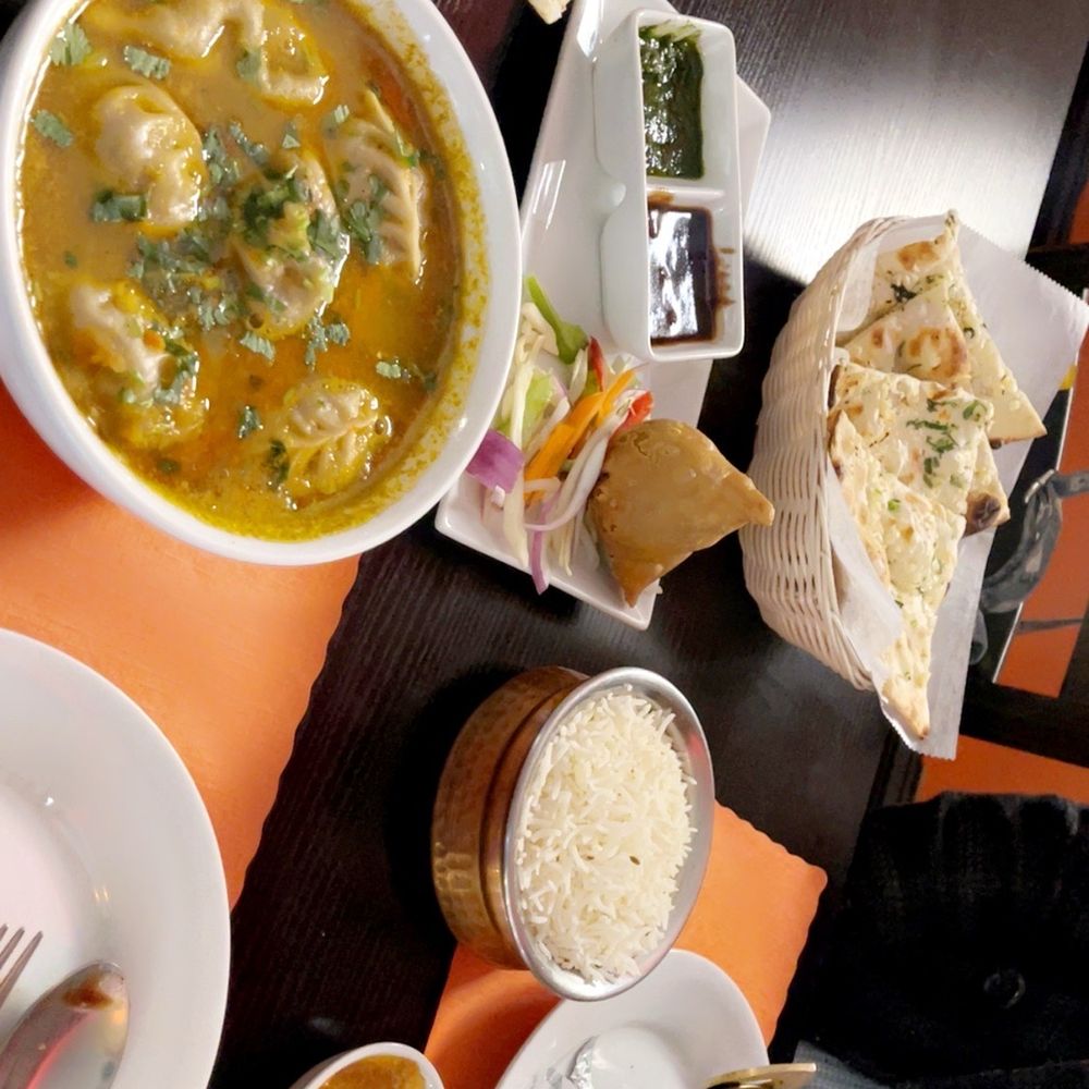 butter chicken, butter garlic nan, coconut nan, Jhol momo, chicken samosa, mango chutney.