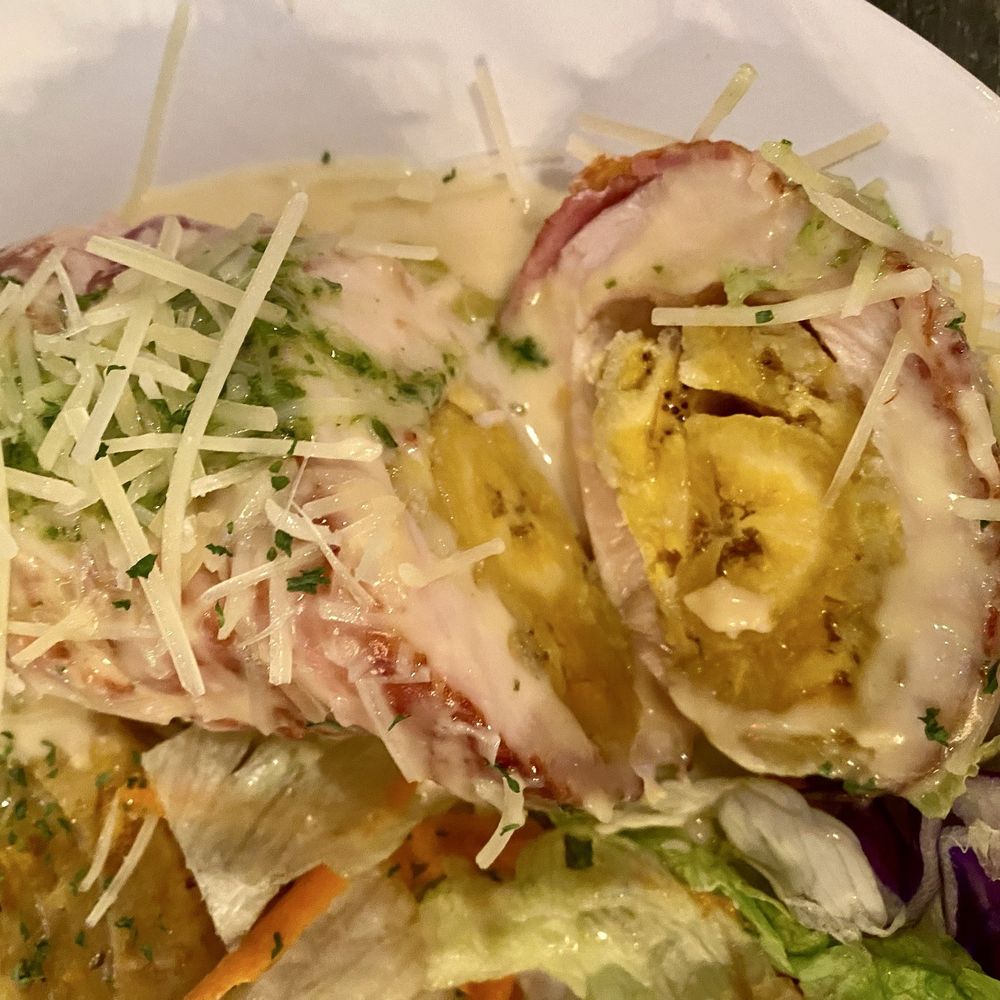 El Tostón Criollo - Pechuga relleno con mofongo (stuffed chicken breast stuffed with maduro and a side of mofongo) - Latin American Near Me - Carolina, Puerto Rico El Tostón Criollo - Pechuga relleno con mofongo (stuffed chicken breast stuffed with maduro and a side of mofongo) - Latin American Near Me - Carolina, Puerto Rico