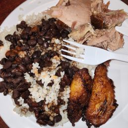 Black beans, white rice, pork and fried plantains