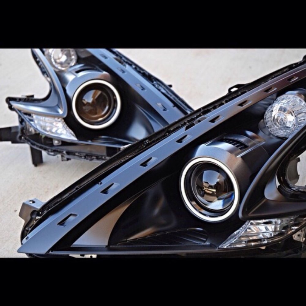 370z headlights. Metallic gunmetal shrouds, cob halos, black housing. 370z headlights. Metallic gunmetal shrouds, cob halos, black housing.