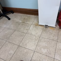 Certified Dermatology - Random drops of dried blood and dirt with rust around garbage can and hazardous waste bin