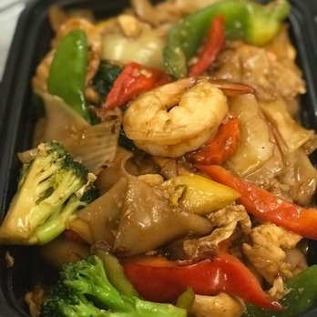 Thai Chili Basil - Drunken Noodle: A popular spicy wide rice noodle stir fried with chicken, shrimp, egg and vegetable in tasty spicy basil sauce. - Thai Near Me - Melrose, Massachusetts Thai Chili Basil - Drunken Noodle: A popular spicy wide rice noodle stir fried with chicken, shrimp, egg and vegetable in tasty spicy basil sauce. - Thai Near Me - Melrose, Massachusetts