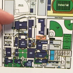 Fullerton College Cosmetology - I'm pointing to the place where there are designated parking spots for cosmetology clients.