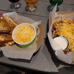 The food from the food truck outside. Grilled cheese with Elote chowder and Frito Pie.