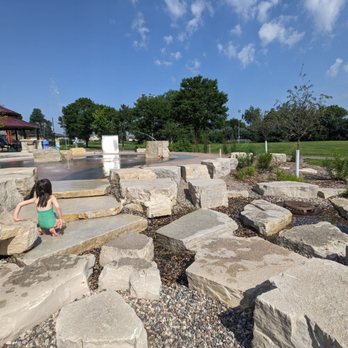 Pioneer Park - The water from the splash pad spills into this more natural but man-made pebble stream. The kids love it. - Playgrounds Near Me - Little Canada, Minnesota Pioneer Park - The water from the splash pad spills into this more natural but man-made pebble stream. The kids love it. - Playgrounds Near Me - Little Canada, Minnesota