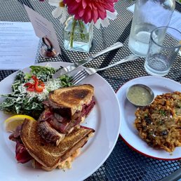 Ruben Sandwich with a side of Cesar and potato pancakes appetizer Ruben Sandwich with a side of Cesar and potato pancakes appetizer