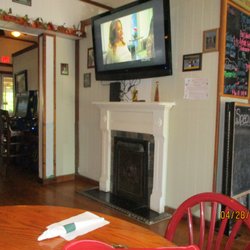 Brother's Italian Restaurant - Brother's Italian Restaurant (Providence Forge): Interior: Far left, arcade games; Center, Gospel TV + faux fireplace.
