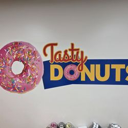 Tasty Donuts - Tasty Donuts sign inside store.