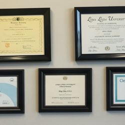 Dr. Ming's accolades adorn the wall.