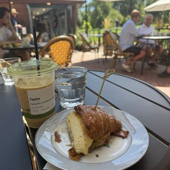 The Carriage House - Croissant breakfast sandwich (PHENOMENAL) and the Pistachio Cardamom coffee - Coffee & Tea Near Me - Denver, Colorado