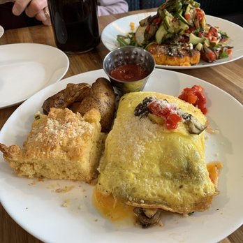 Water for Chocolate - Stuffed Omelet Breakfast, Sweet Potato Polenta and coffee (background) - Breakfast & Brunch Near Me - Baltimore, Maryland Water for Chocolate - Stuffed Omelet Breakfast, Sweet Potato Polenta and coffee (background) - Breakfast & Brunch Near Me - Baltimore, Maryland