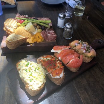 Postino East - Butchers Block and 4 of the different Bruschetta spreads!!! Smoked salmon and pesto was my favorite - Wine Bars Near Me - Gilbert, Arizona Postino East - Butchers Block and 4 of the different Bruschetta spreads!!! Smoked salmon and pesto was my favorite - Wine Bars Near Me - Gilbert, Arizona