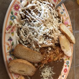 Chilaquiles with salsa roja and shredded chicken! Chilaquiles with salsa roja and shredded chicken!