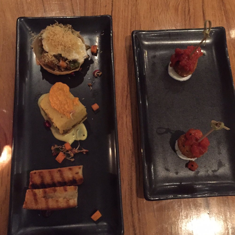 The Bombay street snacks on left and the complementary appetizer on right. The Bombay street snacks on left and the complementary appetizer on right.