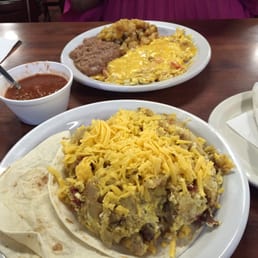 Background: Migas con queso. Foreground: Don Juan taco
