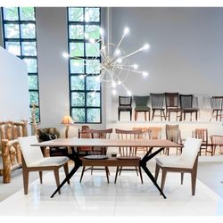 DutchCrafters Alpharetta Furniture Showroom - Amish Jefferson Contemporary Trestle Dining Table and Upholstered Side Chair. Shown in Walnut wood with Natural finish.