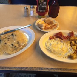 Blueberry pancake, white toast, over medium eggs, bacon, homefries