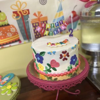 Ashley Bakery - a birthday cake on a table - Bakeries Near Me - Charleston, South Carolina